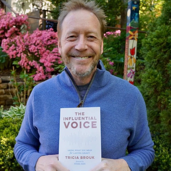 Andrew Bennett holding the influential voice book